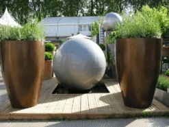 Geo Sphere -Outdoor Decor Art sphereflankedbyvases 04601.1676124709